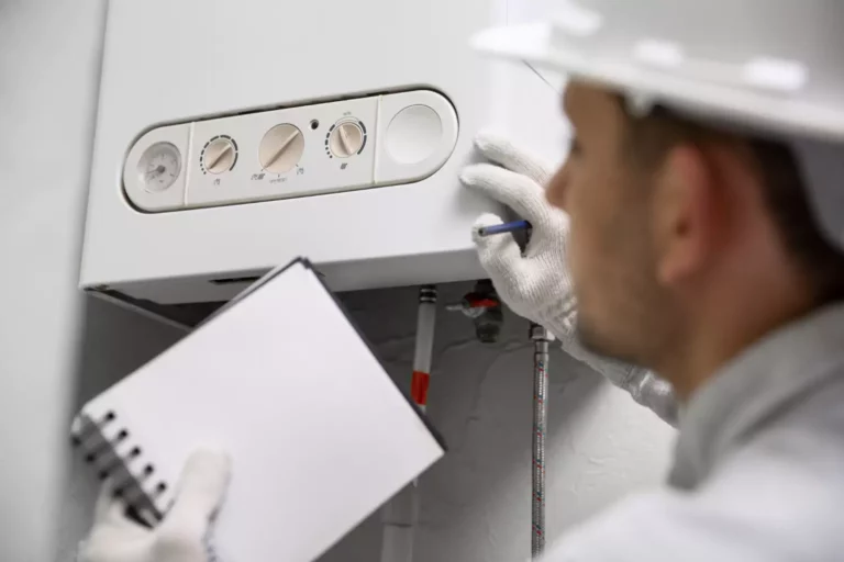 A technician inspecting a gas boiler for safety compliance. The technician is using tools to check the boiler's connections and ensure it is functioning correctly. The image highlights the importance of regular gas safety checks to prevent hazards and maintain proper operation.